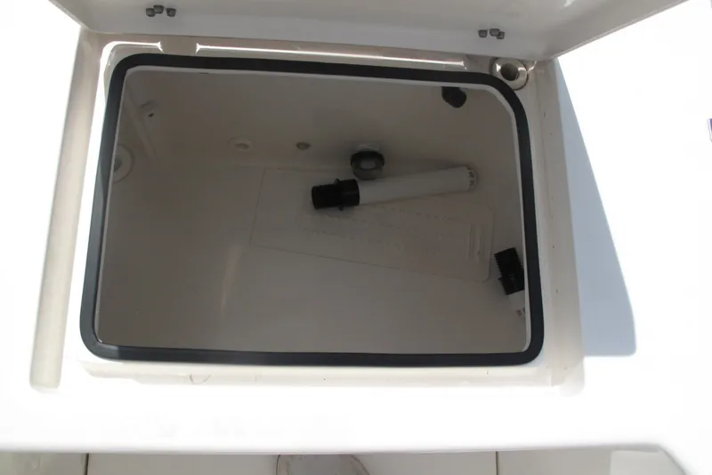 Slide: The Image of Open storage compartment in 2018 Pathfinder 2500 Hybrid boat. - 20