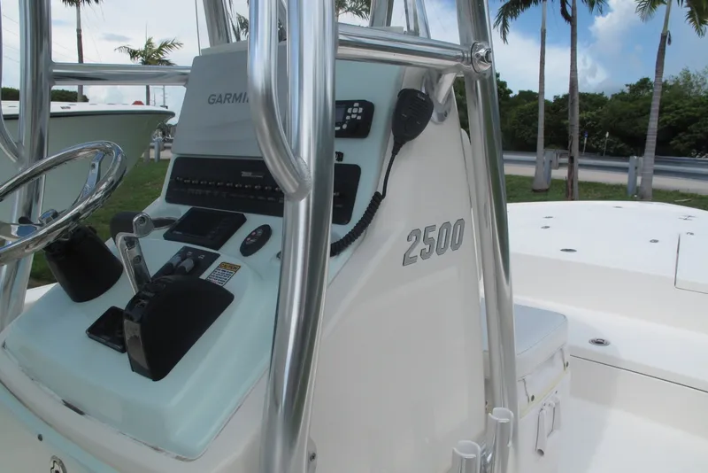 Slide: The Image of 2018 Pathfinder 2500 Hybrid boat console with steering wheel and controls. - 14
