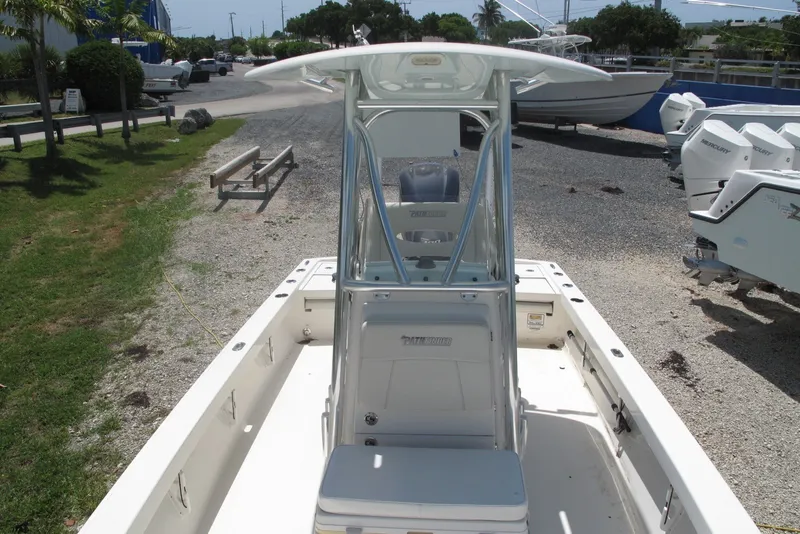 Slide: The Image of 2018 Pathfinder 2500 Hybrid boat with center console, parked outdoors on gravel. - 22