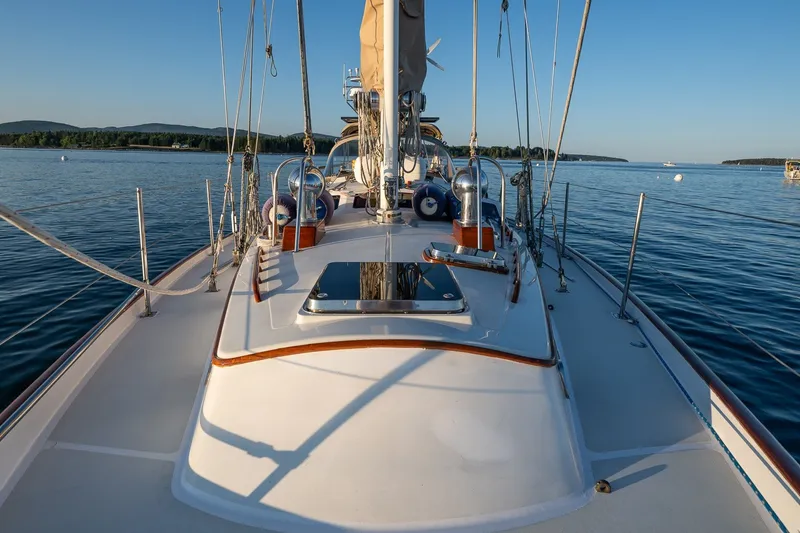 Slide: The Image of Sailboat deck view on calm water, Able 42 model, 1990, with clear blue sky. - 11