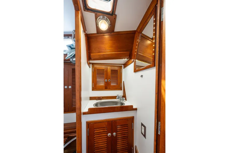 Slide: The Image of Wooden interior of 1990 Able 42 yacht bathroom with sink and mirror. - 39