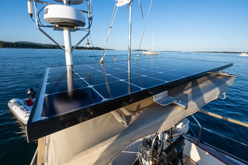 Slide: The Image of Solar panel on Able 42 sailboat, 1990 model, harnessing energy on calm waters. - 44