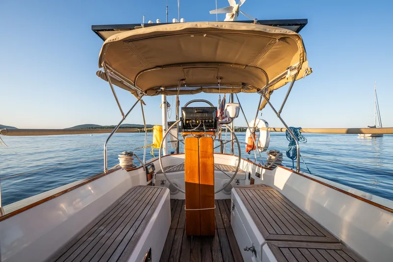 Slide: The Image of Cockpit view of 1990 Able 42 sailboat on calm water under clear sky. - 20