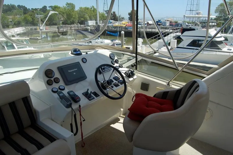 Slide: The Image of Helm of 2007 Navigator 44 Classic yacht with steering wheel and navigation equipment. - 42