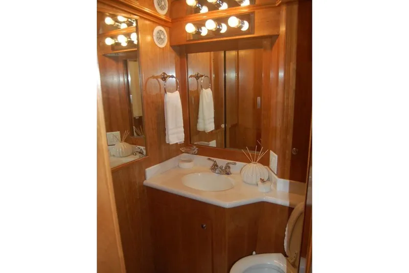 Slide: The Image of Luxurious wooden bathroom interior of 2007 Navigator 44 Classic yacht, featuring elegant lighting and fixtures. - 36