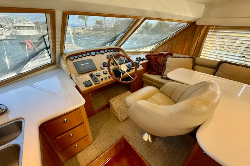 Slide: The Image of Luxurious interior of 2007 Navigator 44 Classic yacht with helm and seating area. - 16