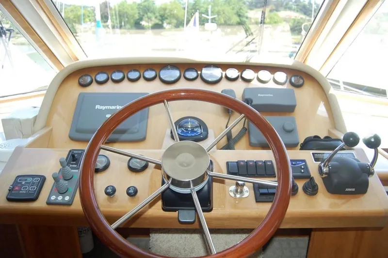 Slide: The Image of Helm of 2007 Navigator 44 Classic yacht with steering wheel and navigation controls. - 15