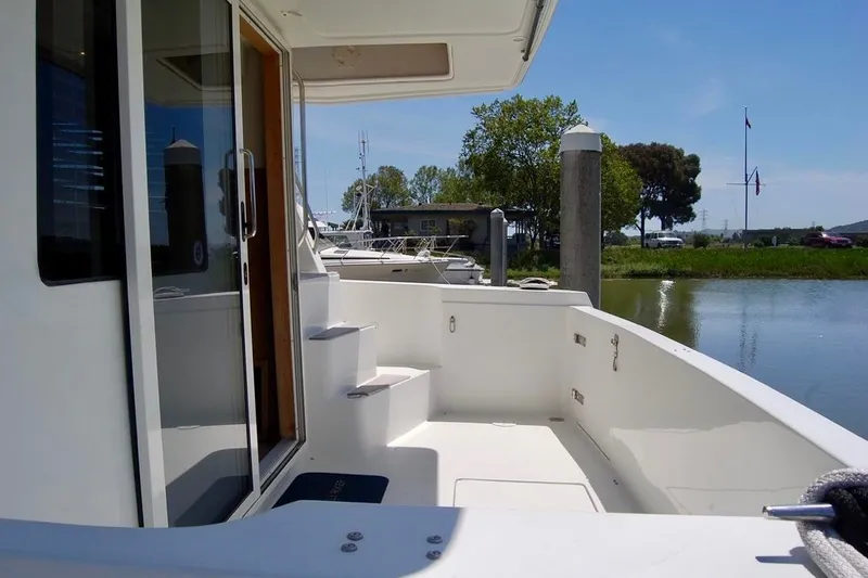Slide: The Image of 2007 Navigator 44 Classic yacht deck with serene marina view. - 4