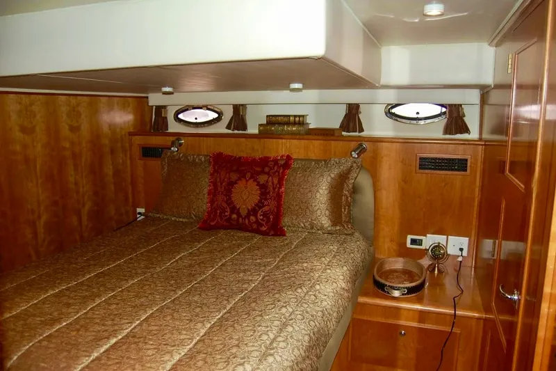 Slide: The Image of Luxurious cabin interior of 2007 Navigator 44 Classic yacht with elegant bedding. - 23