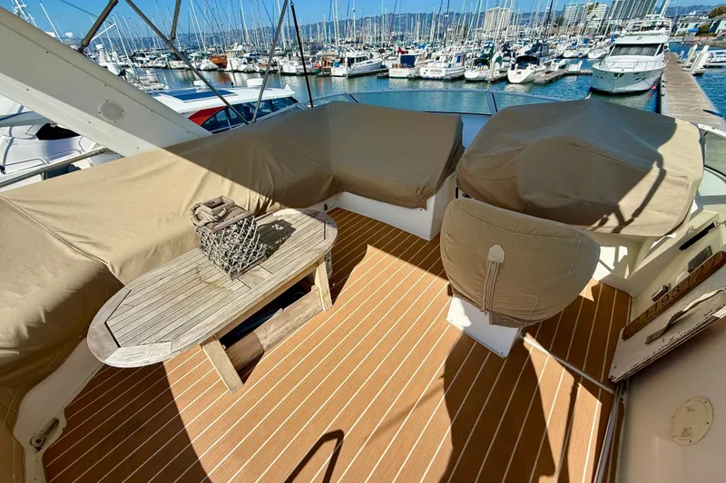 Slide: The Image of Covered seating area on 2007 Navigator 44 Classic yacht with marina view. - 46