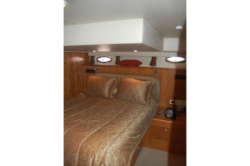 Slide: The Image of Luxurious cabin interior of 2007 Navigator 44 Classic yacht with elegant bedding. - 26