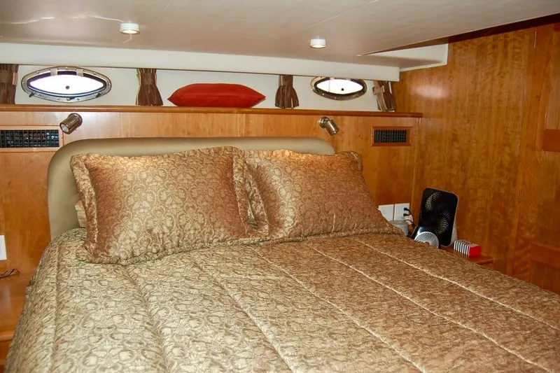 Slide: The Image of Luxurious bedroom interior of 2007 Navigator 44 Classic yacht with elegant bedding. - 24