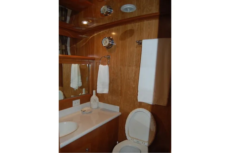 Slide: The Image of Luxurious bathroom in 2007 Navigator 44 Classic yacht with wood paneling and modern fixtures. - 28