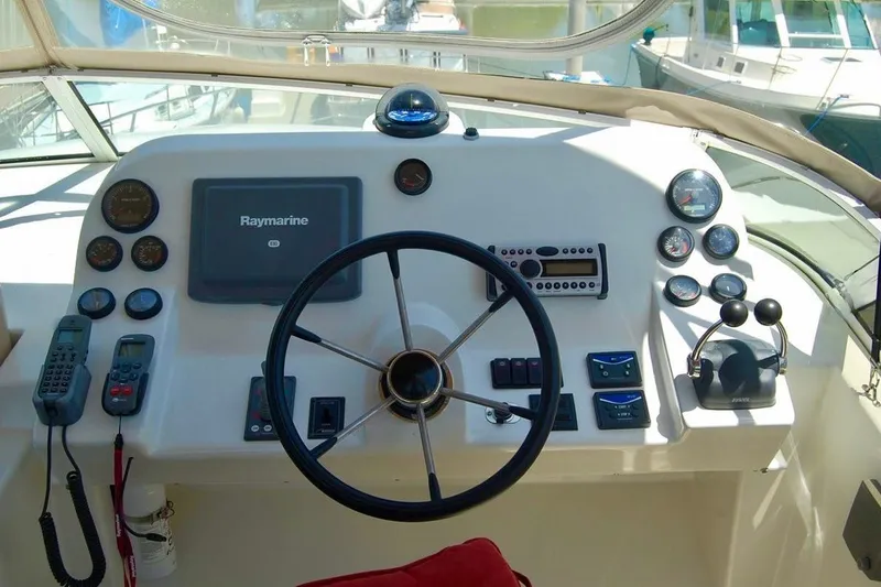 Slide: The Image of Cockpit of 2007 Navigator 44 Classic yacht with steering wheel and navigation instruments. - 41