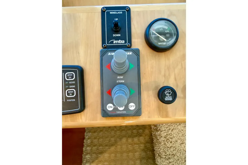 Slide: The Image of Control panel of a 2007 Navigator 44 Classic boat with thruster and wiper controls. - 22