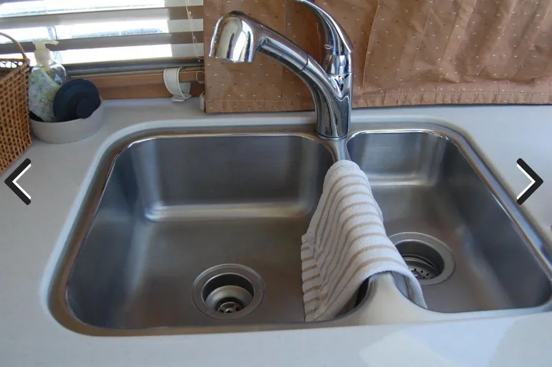 Slide: The Image of Stainless steel sink with faucet in 2007 Navigator 44 Classic yacht kitchen. - 19