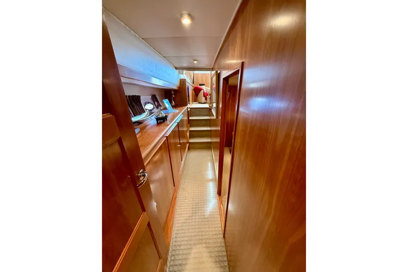 Slide: The Image of Interior hallway of 2007 Navigator 44 Classic yacht with wooden paneling and carpeted floor. - 43
