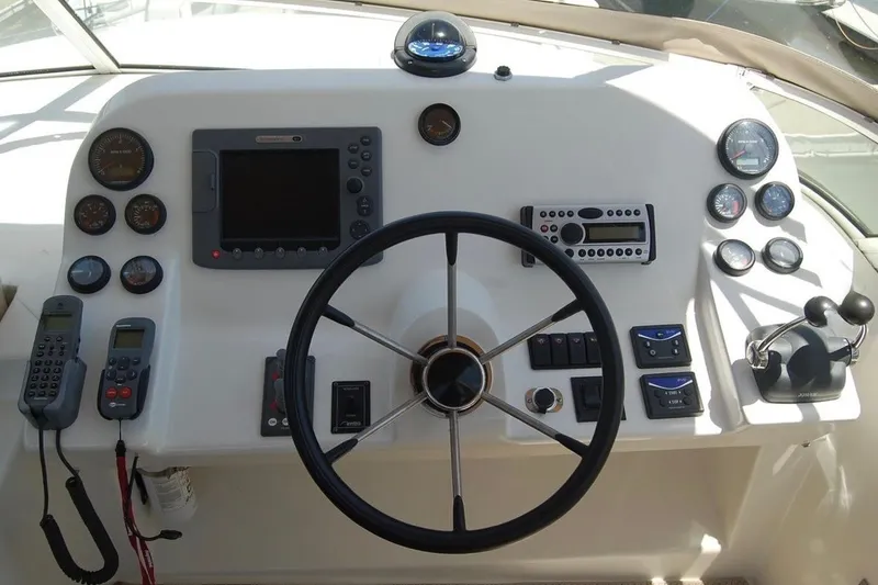 Slide: The Image of Cockpit of 2007 Navigator 44 Classic yacht with steering wheel and navigation instruments. - 40