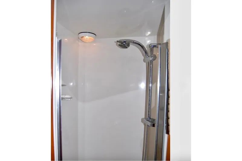 Slide: The Image of Shower area in 2007 Navigator 44 Classic yacht with chrome fixtures. - 30