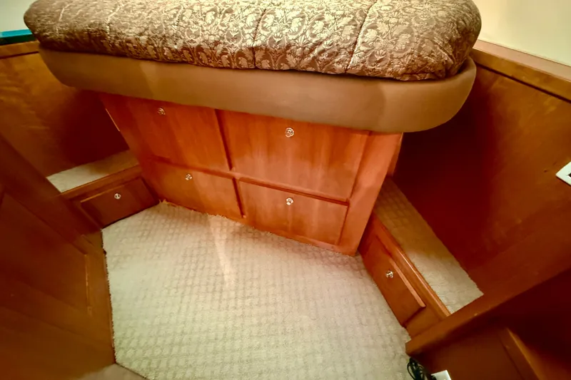 Slide: The Image of Interior cabin of 2007 Navigator 44 Classic yacht with wooden storage and patterned upholstery. - 40