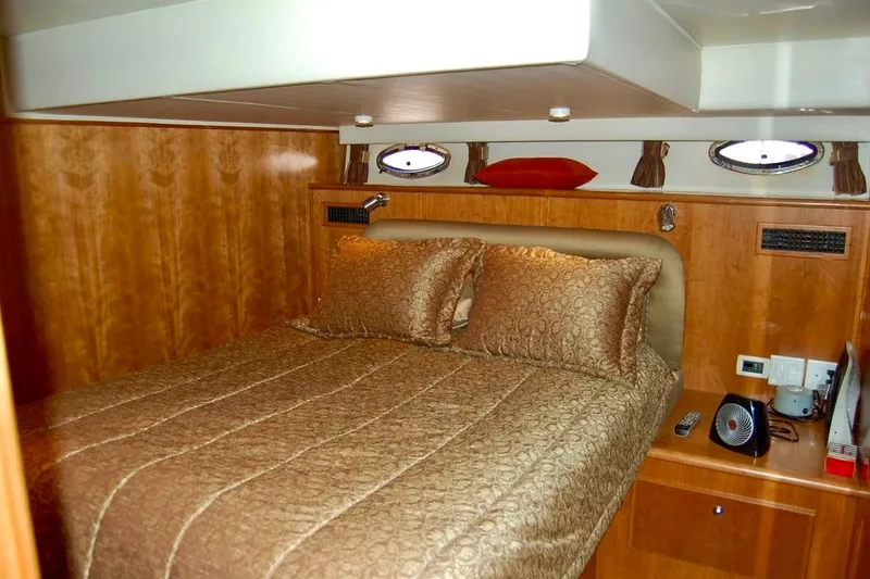 Slide: The Image of Luxurious bedroom interior of 2007 Navigator 44 Classic yacht with elegant bedding. - 22