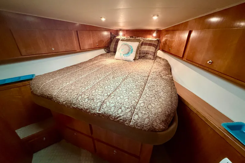 Slide: The Image of Cozy bedroom in 2007 Navigator 44 Classic yacht with wood cabinets and patterned bedding. - 37
