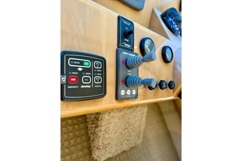 Slide: The Image of Control panel of a 2007 Navigator 44 Classic yacht with various switches and indicators. - 26