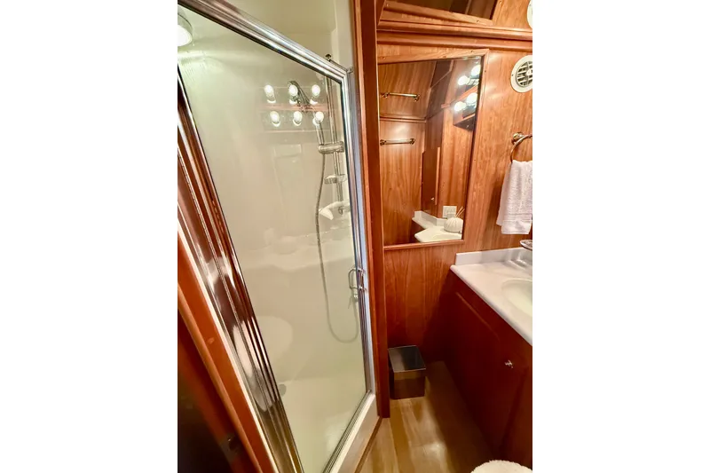 Slide: The Image of Luxurious bathroom in 2007 Navigator 44 Classic yacht with shower and wooden cabinetry. - 42