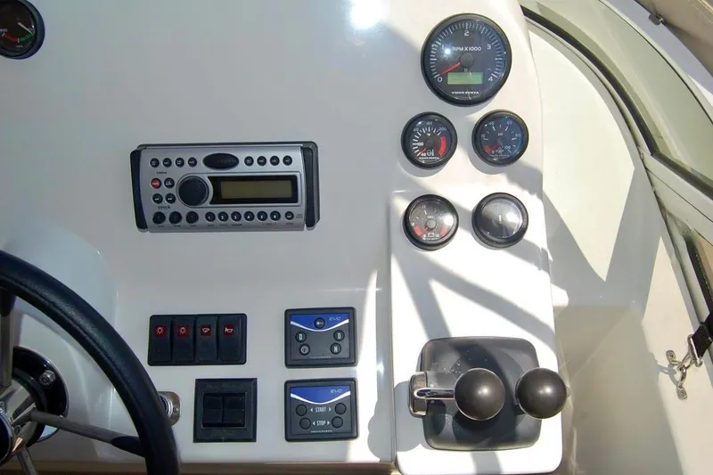 Slide: The Image of 2007 Navigator 44 Classic helm with gauges, controls, and radio system. - 44