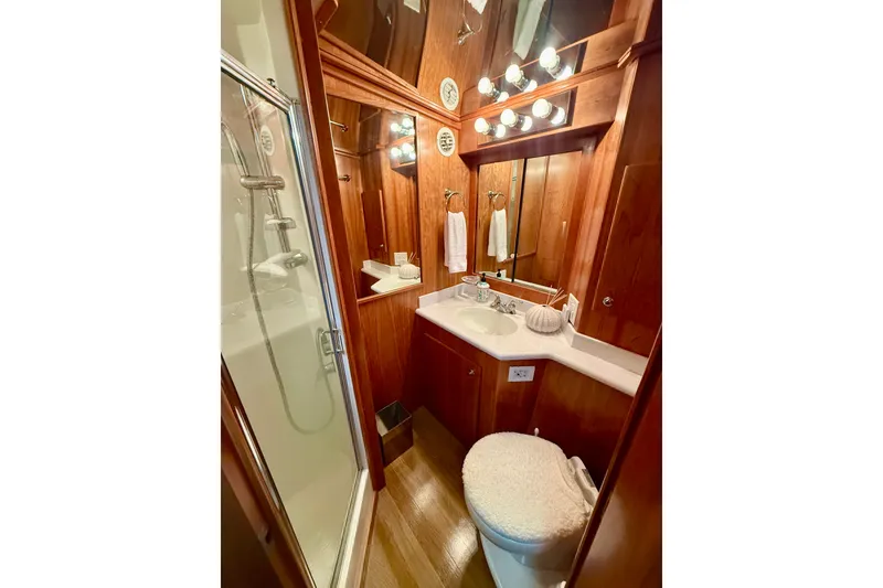 Slide: The Image of Luxurious bathroom in 2007 Navigator 44 Classic yacht with wood accents and modern fixtures. - 41