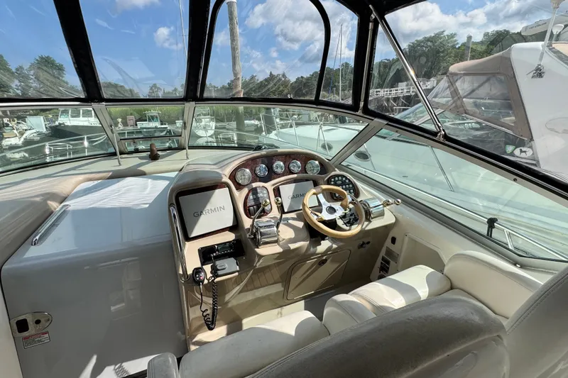Slide: The Image of Helm of 2005 Sea Ray 340 Sundancer with Garmin navigation system and luxurious seating. - 6