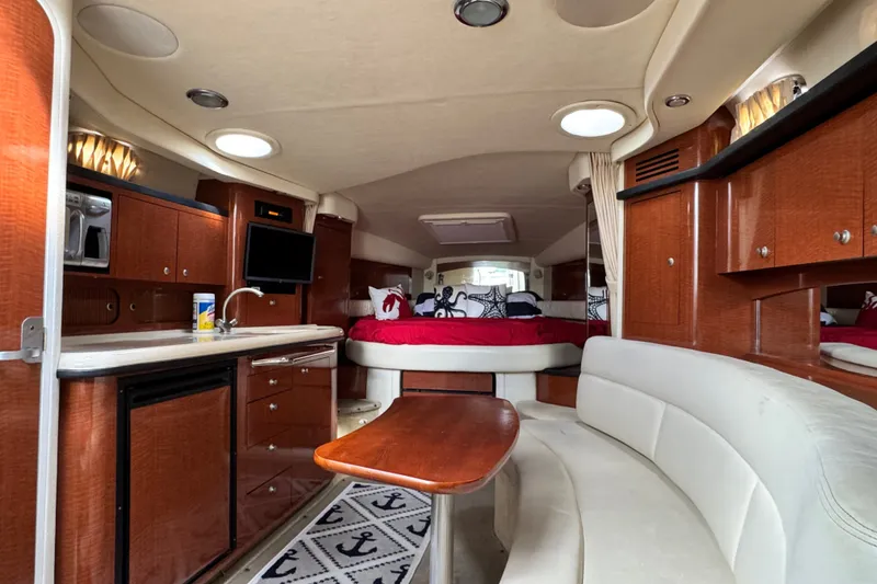 Slide: The Image of Luxurious interior of a 2005 Sea Ray 340 Sundancer yacht with wood cabinetry and cozy seating. - 17