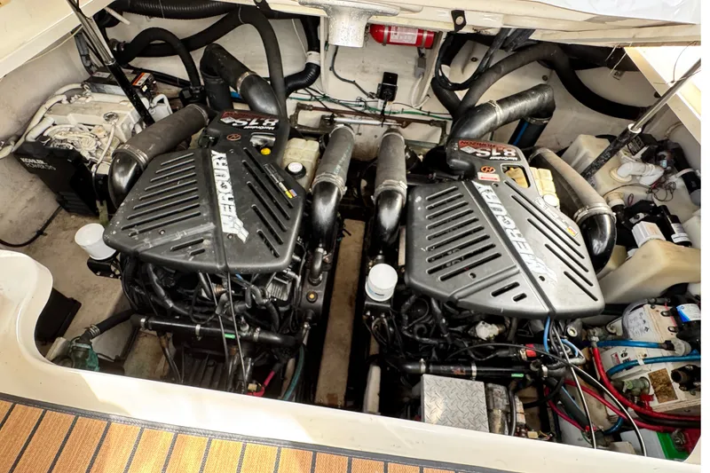 Slide: The Image of Engine compartment of a 2005 Sea Ray 340 Sundancer with twin Mercury engines. - 26