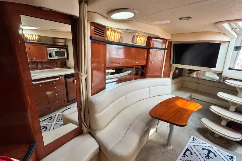 Slide: The Image of Luxurious interior of a 2005 Sea Ray 340 Sundancer yacht with elegant wood finishes. - 18