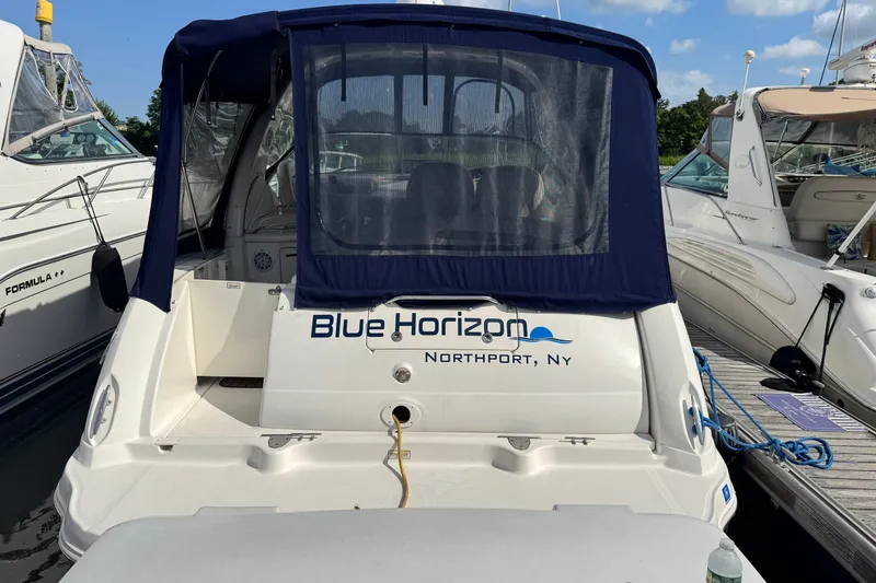 Slide: The Image of 2005 Sea Ray 340 Sundancer docked, featuring "Blue Horizon" name and Northport, NY location. - 2