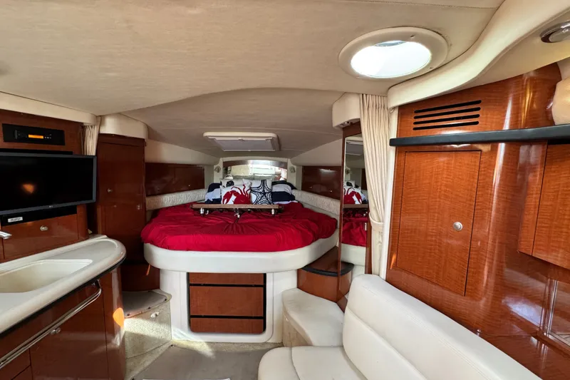 Slide: The Image of Luxurious interior of 2005 Sea Ray 340 Sundancer yacht with cozy bed and modern amenities. - 14