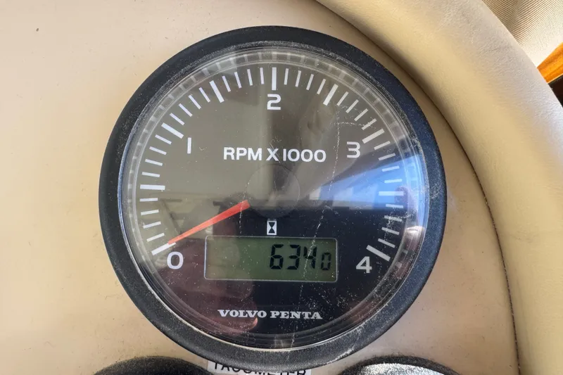 Slide: The Image of Volvo Penta tachometer displaying 6340 RPM on 2006 Navigator 34 Californian boat. - 38