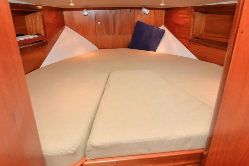 Slide: The Image of Cozy cabin interior of 2006 Navigator 34 Californian yacht with wooden finish and comfortable bedding. - 23