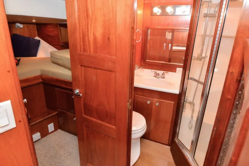 Slide: The Image of Interior of 2006 Navigator 34 Californian yacht with wooden bathroom and cozy sleeping area. - 25
