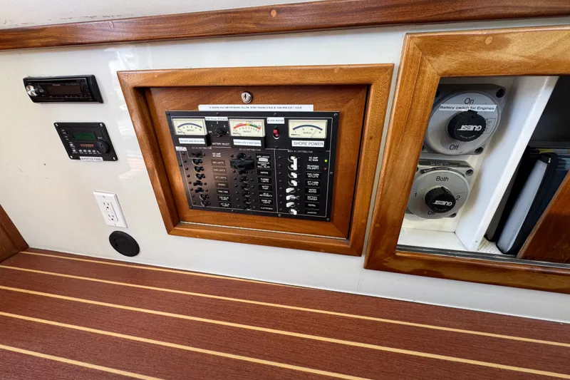Slide: The Image of Electrical control panel on 2006 Navigator 34 Californian boat with wood trim and switches. - 15