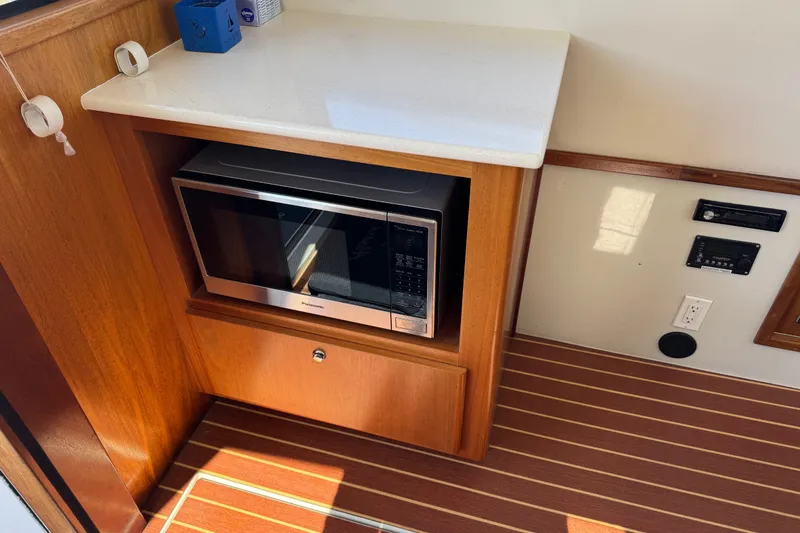 Slide: The Image of Microwave in wooden cabinet on 2006 Navigator 34 Californian yacht interior. - 16