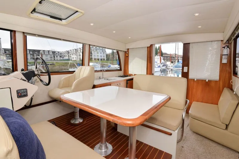 Slide: The Image of Interior of 2006 Navigator 34 Californian yacht with seating and helm station. - 20