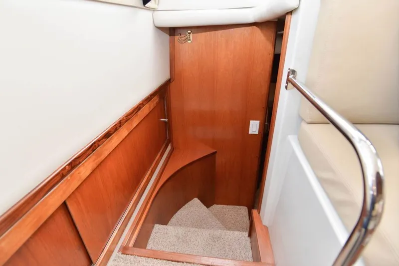 Slide: The Image of Interior stairs of 2006 Navigator 34 Californian yacht, featuring wood paneling and carpeted steps. - 22