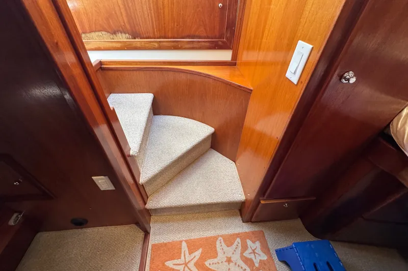 Slide: The Image of Interior stairs of 2006 Navigator 34 Californian yacht with wooden paneling. - 28