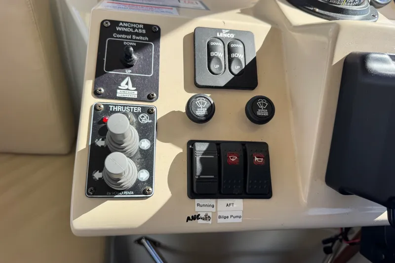 Slide: The Image of Control panel of a 2006 Navigator 34 Californian boat with thruster and anchor switches. - 33