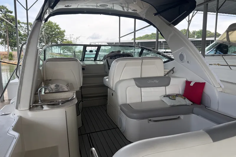 Slide: The Image of Interior view of a 2011 Sea Ray Sundancer 350 yacht with seating and kitchenette. - 8