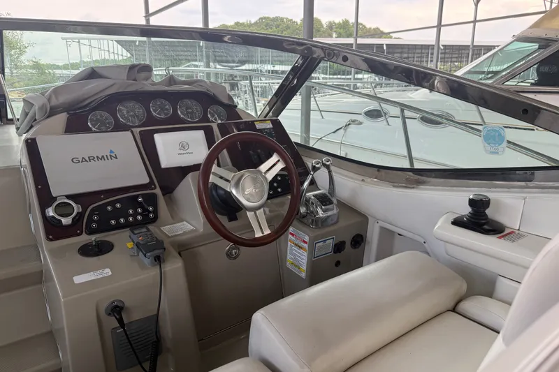 Slide: The Image of Cockpit of 2011 Sea Ray Sundancer 350 with Garmin navigation system and steering wheel. - 9