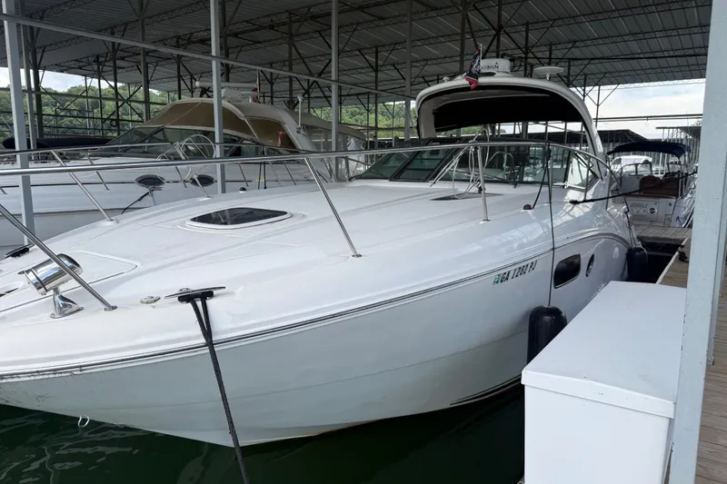Slide: The Image of 2011 Sea Ray Sundancer 350 yacht docked in a covered marina. - 1