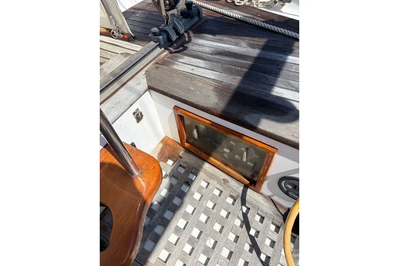 Slide: The Image of Cockpit of 1973 Westsail 32 sailboat with wooden and metal details. - 7