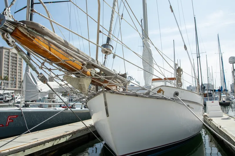 The Image of 1973 Westsail 32 sailboat docked at a marina, showcasing classic nautical design. - 0